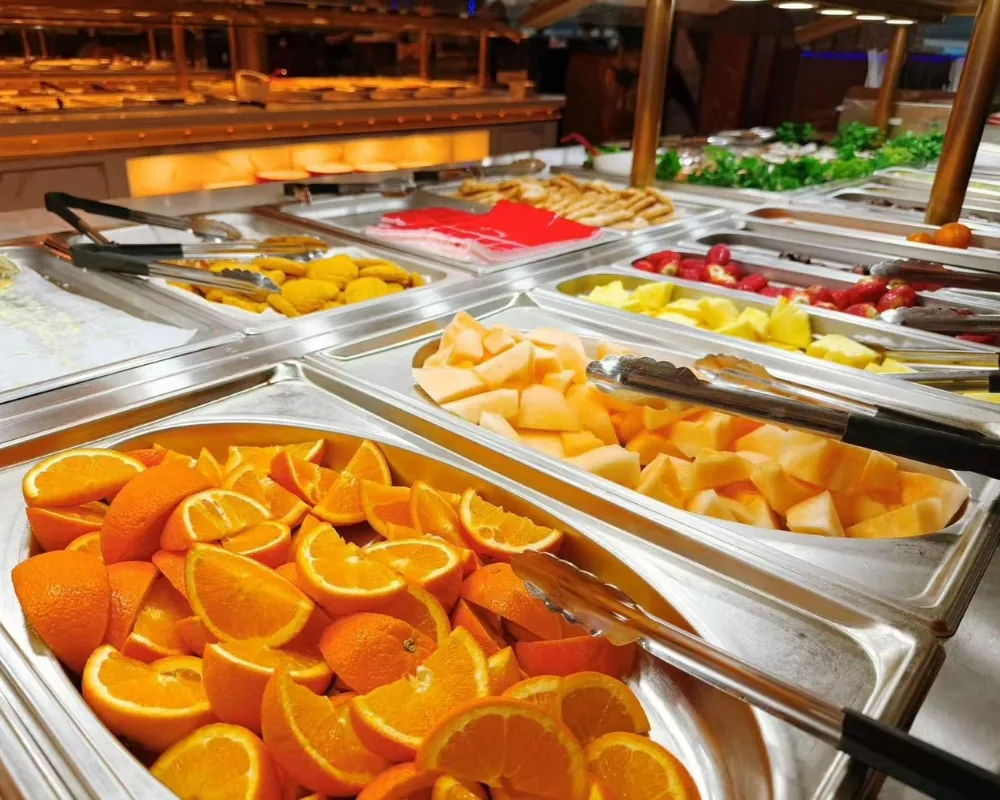 Assorted fresh fruits including oranges and melon at Ichiraku Seafood Buffet & Grill, a Asian Restaurant in North Providence